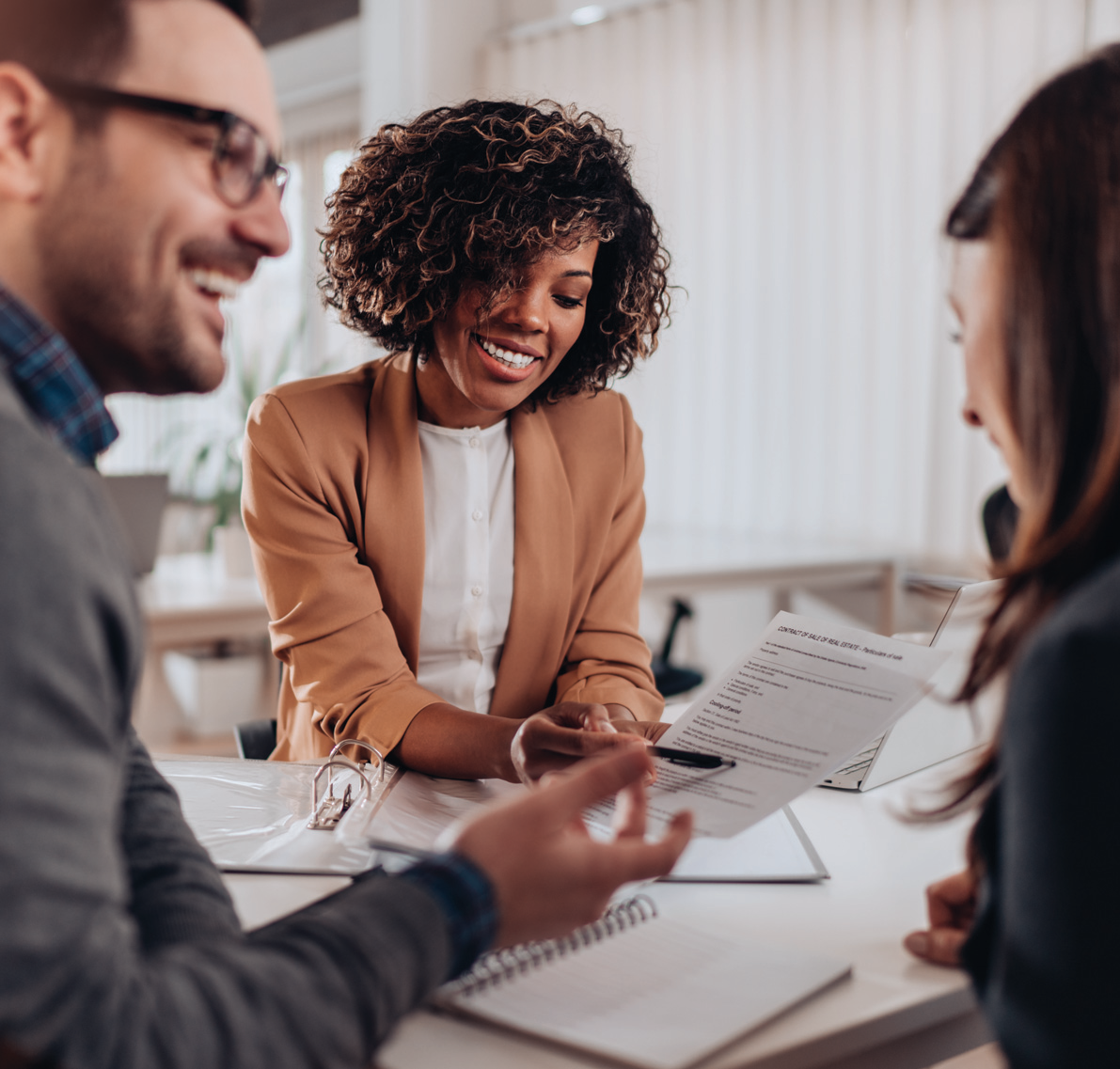 Business professionals discussing an opportunity around a table